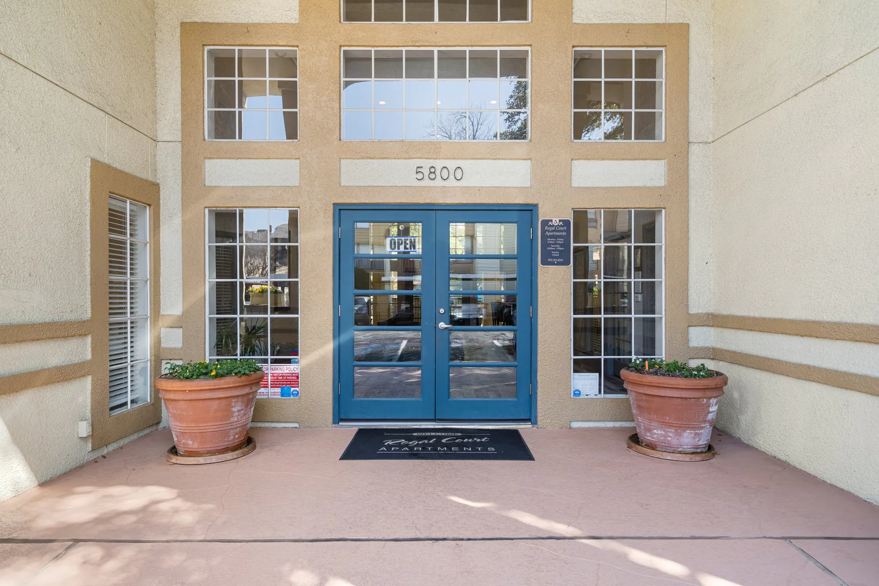 Leasing office entrance at 5800 Preston View Blvd, Regal Court Apartments
