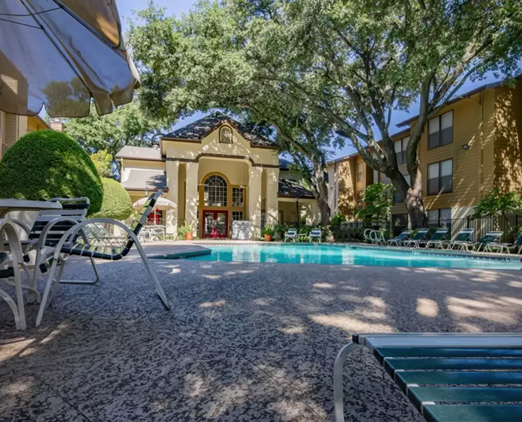 Lounge chairs and umbrellas along the Regal Court pool deck