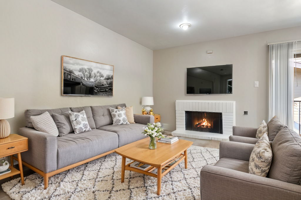 Living room with fireplace at Regal Court Apartments